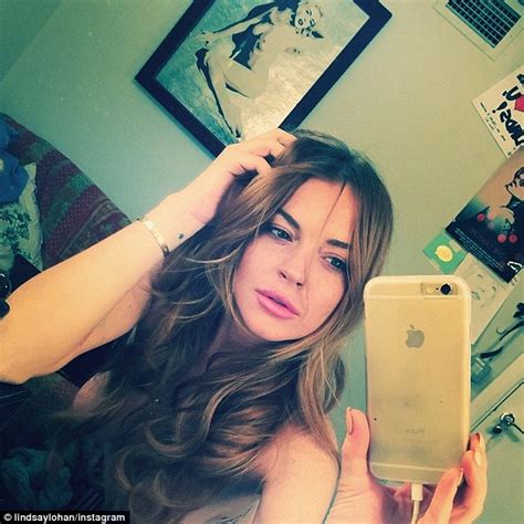 Lindsay Lohan Posts Another Revealing Selfie Of Herself As She Poses In Lace Bra And Black Cape