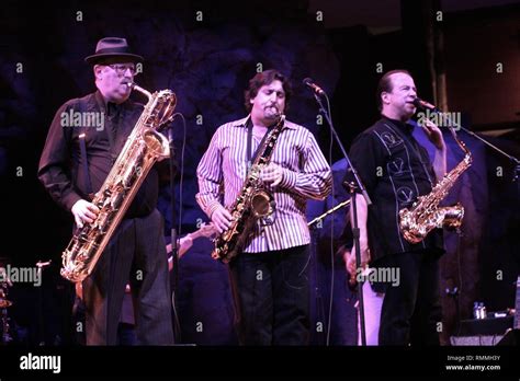 Tower Of Power Band Members Are Shown Performing On Stage During A