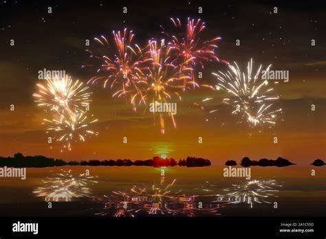 Colorful Glowing Celebration Fireworks On A Sunset Sky Stock Photo Alamy