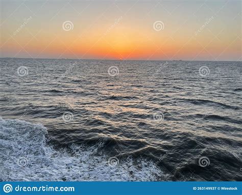 Beautiful Shining Golden Orange Sunset Reflected On Surface Of The