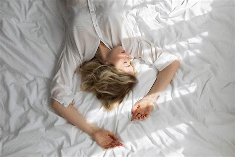 Woman Lying On Bed In The Morning By Stocksy Contributor Lumina Stocksy
