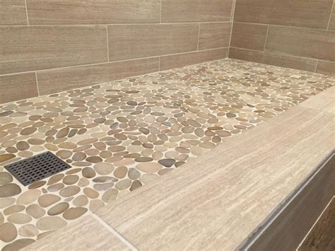 The river rock random sized metal mosaic tile in stainless steel black and silver is where nature and modern design converge. Riverstone Shower Floor in Mid Century Style | Roy Home Design