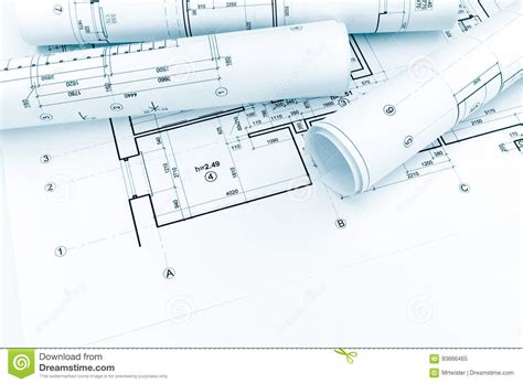 Rolled Architectural Plans And Technical Drawings On House Blueprint