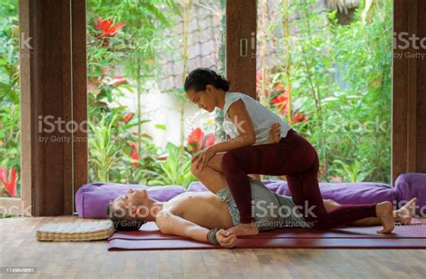 Young Beautiful And Exotic Asian Indonesian Therapist Woman Giving