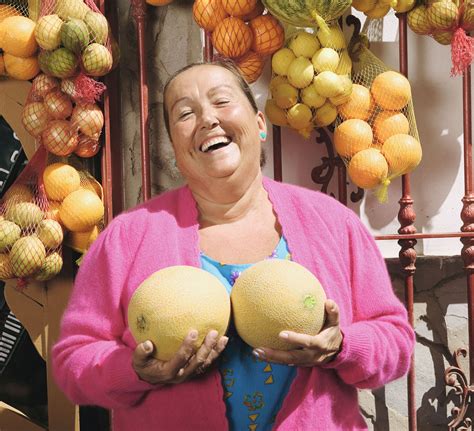 Mature Woman Holding Melons To Chest Outdoors Laughing Portrait Shehr