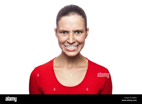 Portrait Of Worried Angry Woman In Red T Shirt With Freckles Looking
