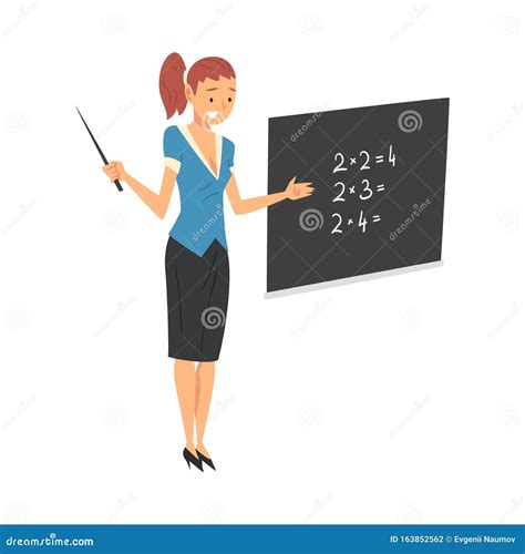 Female Teacher Standing Beside Chalkboard And Explaining Math Lesson