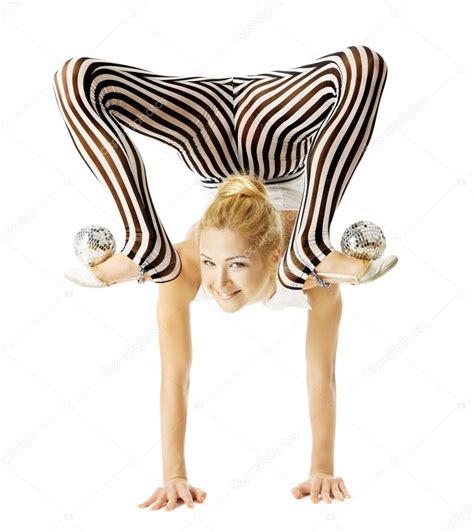 circus gymnast woman flexible body standing on arms upside down balancing balls on feet