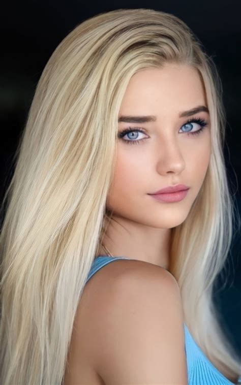A Woman With Long Blonde Hair And Blue Eyes