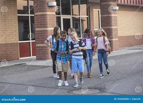 Large Diverse Group Of Kids Leaving School At The End Of The Day