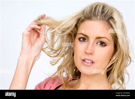 Woman Playing With Her Hair Flirtation Body Language Stock Photo Alamy