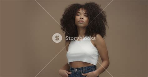 Mixed Race Black Woman Portrait With Big Afro Hair Curly Hair In Beige Background Royalty Free