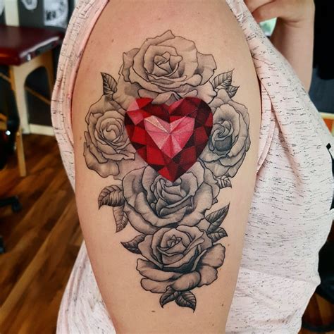 It's a broken heart out of which comes the rose. Diamond heart and rose Tattoo done by @rustemhorzum at ...