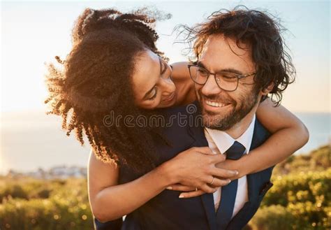 wedding interracial and couple hug in nature happy and excited while celebrating love