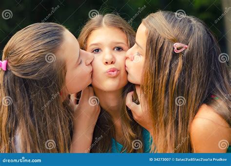 teenage girl kissed on the cheeks stock image image of lady holding 34273007
