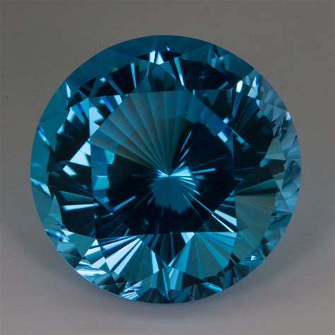 24-98-carat-blue-topaz,-natural-round-fancy-cut,-18mm,-brazil