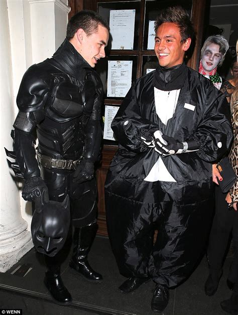 one direction s liam payne transforms into batman for halloween night out with pal tom daley
