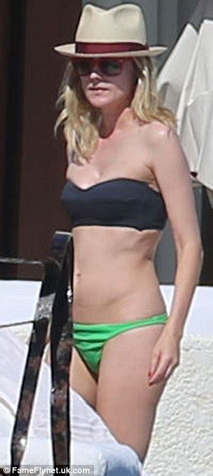 Check spelling or type a new query. Diane Kruger in a black and green bikini