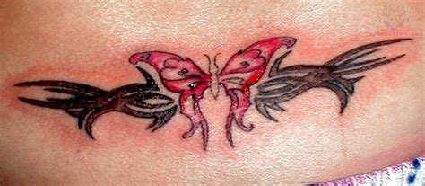 Red Butterfly And Tribal Lowerback Tattoo