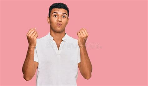 Young Arab Man Wearing Casual Clothes Doing Money Gesture With Hands