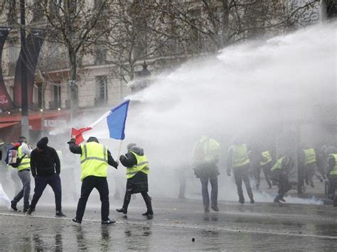 Riot Police Fire Tear Gas And Water Cannon At Fuel Protesters In Paris