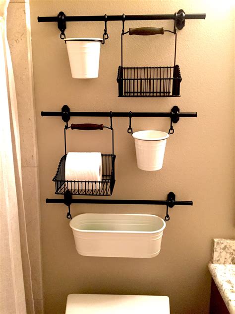 I took ikea basket drawers and some wallpaper and brads and made some great looking storage where things won't fall through the wires. IKEA Fintorp | Diy bathroom storage, Ikea bathroom ...