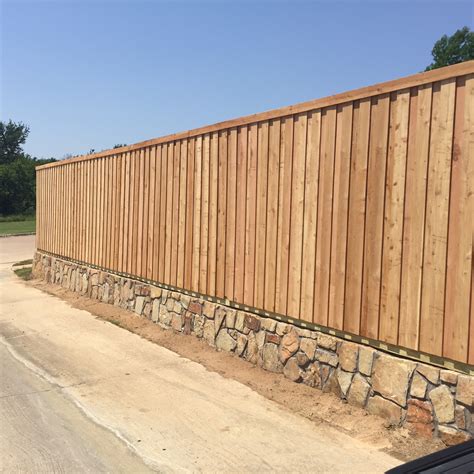 Dry stone wall surrounds a replica of a traditional blackhouse built by the dswac in ontario, canada. Retaining Wall Contractor | Dallas | JCL Landscaping