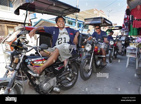 A Line Of Filipino Trike Drivers Waiting For Passengers In Barretto