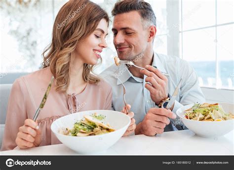 Photo Of Adult Romantic Couple Having Dinner And Eating Salats W