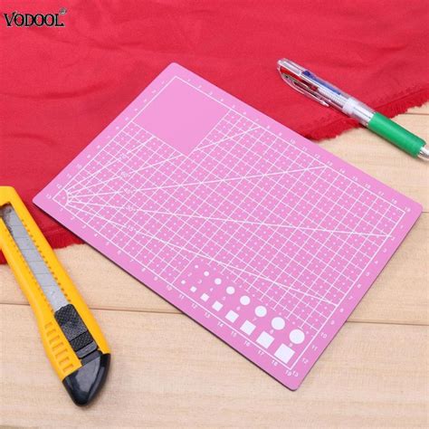 Personally, i prefer to work shiny side up (i feel like it adheres much better to the cutting. Aliexpress.com : Buy A5 PVC Cutting Mat Cutting Pad Patchwork Cut Pad Patchwork Tools Manual DIY ...