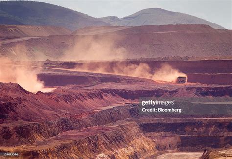 Haul Trucks Operate In The Pit At Rio Tinto Groups West Angelas Iron