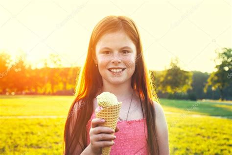 Redhead Girl Eating Ice Cream Stock Photo Dedivan