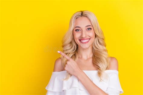 Portrait Of Attractive Cheerful Wavy Haired Girl Demonstrating Copy