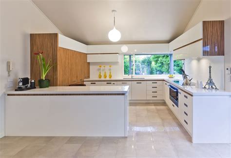 The flat front cabinets are a consignment store find. wood and white modern kitchen | Interior Design Ideas.