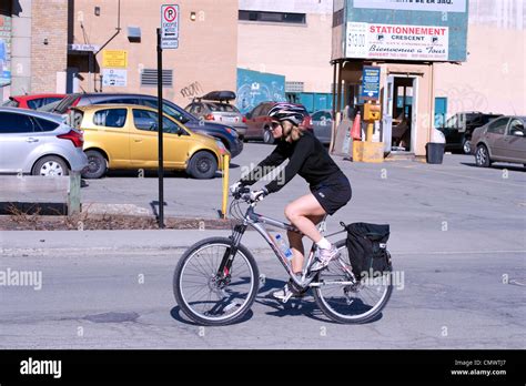 Woman Riding Her Bike In Downtown Montreal Province Of Quebec Canada