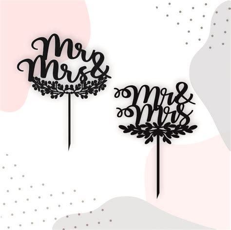 Two Cake Toppers With The Words Mr And Mrs On Them