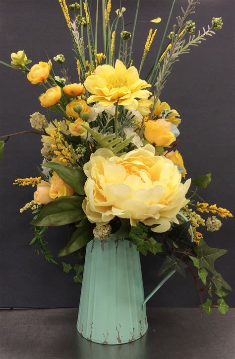 Classic Yellows In A Pitcher By Andrea Spring Flower Arrangements