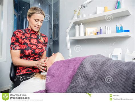 Beautician Giving Head Massage To Customer In Salon Stock Photo Image