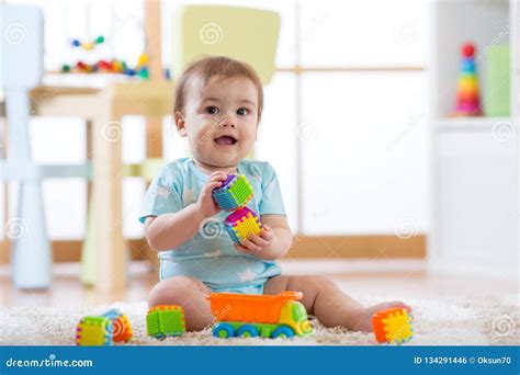 Baby Playing Toys In Nursery Or Daycare Stock Photo Image Of Child
