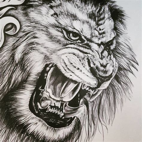 Lion Chest And Sleeve Tattoo