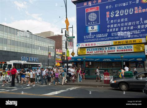 The Busy Intersection Of Main Street And Roosevelt Avenue In The