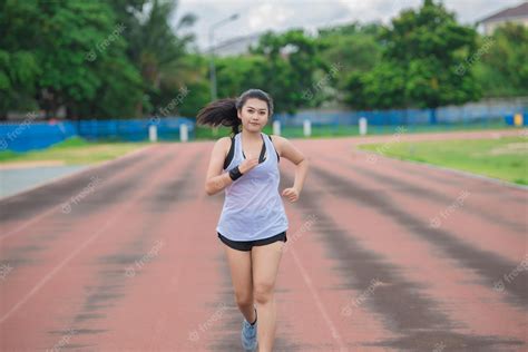 Premium Photo Asian Beautiful Woman Running On The Trackthailand Peoplethe Runners Run