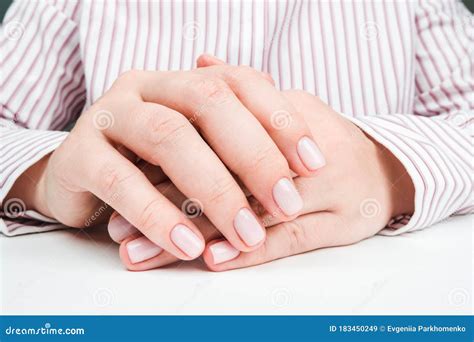 Delicate Well Groomed Female Hands With Nude Manicure Close Up Stock