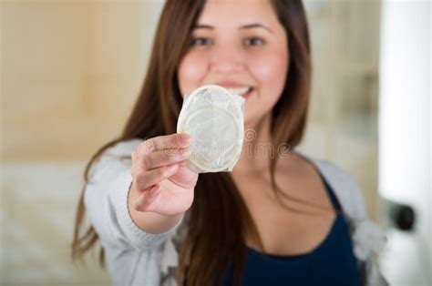 Young Beautiful Girl Holding An Open Female Condom Safe Sex Concept