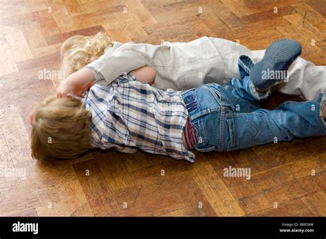 Two Young Boys Fighting On Floor Stock Photo Alamy