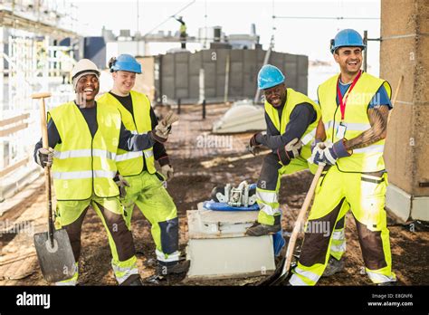 Happy Construction Workers At Construction Site Stock Photo Alamy