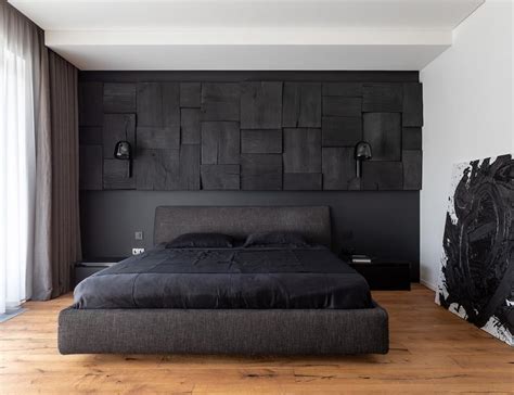 A Blackened Wood Accent Wall Provides Some Creative Texture In This Bedroom