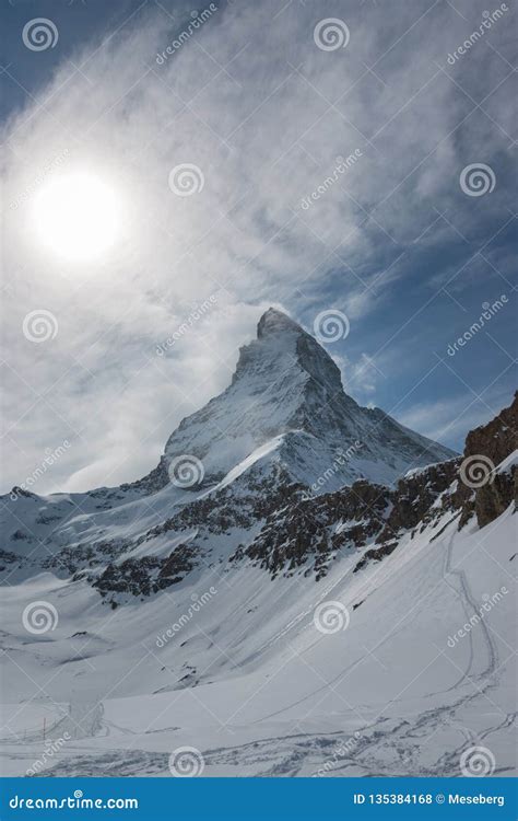 Majestic Matterhorn Mountain In Front Of A Partly Cloudy Sky Stock