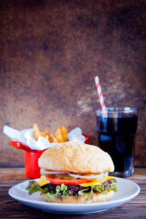 Homemade Burger Fries And Cold Drink On Wooden Background Stock Photo