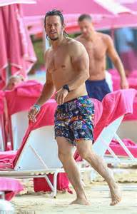 mark wahlberg continues to parade his impressive beach body in barbados daily mail online